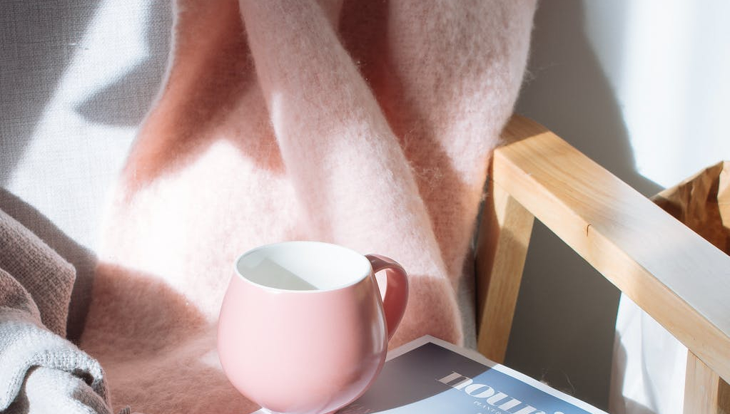 pink mug and magazine